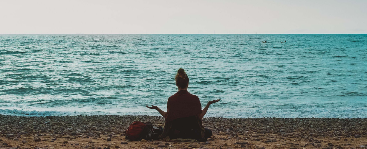 person-person-doing-yoga-on-seashore-during-daytime-human-human-image