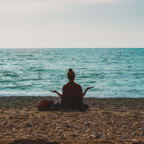 person-person-doing-yoga-on-seashore-during-daytime-human-human-image